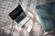 © astrosystem - Smartphone and laptop at home – remote work, online communication and digital lifestyle.