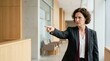 © OlgaNeuroArt - Professional businesswoman in suit pointing finger in accusation gesture. Serious female lawyer pointing in modern hallway