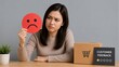 © Formoney - Young woman holding sad feedback sign with package at desk complaint