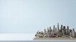 © Explorer abandoned - Miniature city model with modern skyscrapers and urban architecture displayed on light blue background