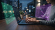 © Inspire Shots Hub - Person working on laptop with futuristic holographic displays showing charts and data, symbolizing innovation and future technology.