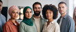 © itlada - Diverse group of multicultural people standing together in a bright studio setting, highlighting ethnic diversity and workplace inclusion for modern corporate campaigns
