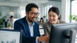 © MuhammadYunusArdian - Working together on project. Two young business colleagues working on computer.