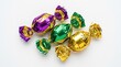 © Ariestia - Three Assorted Candies in Shiny Metallic Foil Wrappers Isolated on White Background for Festive Celebration