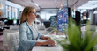 © Andrey Popov - Young Woman Builds Automation Workflows