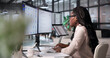 © Andrey Popov - Young African Woman Uses Smart Software