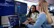 © Andrey Popov - Young African Woman Programs Software Remotely Using Cloud Tools