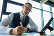 © be free - Business success. Businessman using tablet in business office. Freelancer working online. Man CEO at working place, modern office. Businessman with tablet in office. Corporate online meeting