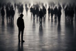 © AungThurein - One isolated person silhouette standing apart from a large group of blurred silhouettes, social exclusion and loneliness concept