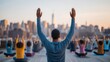 © 1389 - A group of people practicing yoga outdoors with a city skyline in the background, promoting mindfulness and wellness.
