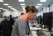 © Светлана Волынкина - Female call center operator leaning toward a computer with tense shoulders and a glowing red cervical spine overlay. Repetitive office work and chronic neck tension concept