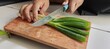 © Ndang - young woman cutting vegetables