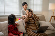 © Crystal - Stressed mother struggling with children while working from home