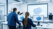 © tanin - A group of engineers collaborating in a modern office with computer screens displaying technical designs