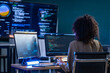© ultramansk - Brazilian cybersecurity expert conducting a real time threat assessment and debugging system vulnerabilities on a large scale AI monitoring display.