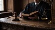 © Imam - Justice and law concept. Gavel on sounding block in hand's Male judge at a courtroom, working with document law books, report the case on table in modern office.