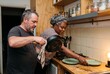 © Leo Rohmann - Dishwashing in a shared kitchen with two adults handling evening cleanup