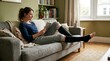 © Rafi Hasan - Woman relaxing on grey sofa reading book wearing black compression socks, legs extended, cozy living room with bookshelf, natural daylight, comfortable home lifestyle moment