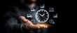 © Atchariya63 - Business professional holding virtual clock interface with productivity and time management icons for deadline planning and scheduling efficiency