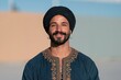 © Iryna - Smiling bearded man in embroidered tunic and dark turban portrait for cultural lifestyle background and male fashion headshot usage