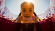 © LOUISE CLAIRE GIRARD - Young girl looking into a glass of purple beverage outdoors under bright sunlight. Child with freckles and braids peering down through a wide-angle POV perspective. Summer refreshment concept.