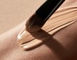 © Alfais - Makeup brush applying foundation onto skin in a smooth sweep