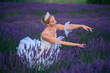 © Metadancer - A ballerina in a lavender field gracefully poses among vibrant flowers
