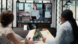 © DC Studio - Recruiters and applicant engage in a virtual call using a webcam and high-tech tools while reviewing the resume and assessing job search progress during a remote interview conference.