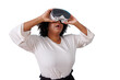 © Komora - Woman experiencing virtual reality metaverse, wearing vr headset goggles, reaching out to explore digital immersive world