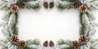 © MdMusiur - Christmas frame made of pine branches and pine cones for seasonal decoration