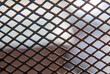 © Bang - Rusty Chain Link Fence Metal Grid Texture with Weathered Steel Wire Mesh Pattern for Industrial Background, Security Barrier, Seamless Wallpaper and Abstract Design