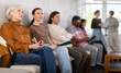© JackF - Calm mature woman applicant sitting in a queue at a modern office waiting-room