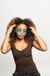 © Gonzalo Infiesta - Young woman applying under eye patches for skincare routine