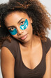 © Gonzalo Infiesta - Young woman applying under eye patches for skincare routine