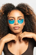 © Gonzalo Infiesta - Young woman receiving under eye skincare treatment