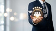 © HADI INCREDIBLE - Businessman holding digital customer experience icons representing service quality, teamwork, business partnership, goal achievement and professional reliability.