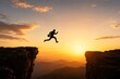 © Glyph Studio - Silhouette of a man jumping across a gap between two mountain cliffs at sunset
