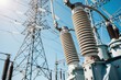 © V-I-S-T-A FORGE - High voltage electrical substation components under clear blue sky. Professional imagery depicting energy distribution and modern power grid infrastructure.
