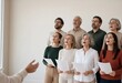 © SplitStudio - Choir rehearsal the moment every head lifts to the conductor at the same second, singing together in a community choir with copy space