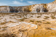 © Travel 'n' Lifestyle - View of the dramatic white limestone cliffs and cracked dry earth of the Tuzbair salt flats in Mangystau District, Mangystau Region, Kazakhstan.