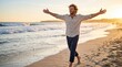 © Женя Окорський - Happy Man with Open Arms Walking on the Beach at Sunset