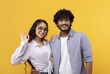 © Prostock-studio - Smiling Young Couple, Man And Woman, Showing Positive Emotions Together In A Bright Setting. Happy Relationship, Joyful Interaction Captured In A Studio Environment. Lifestyle Concept.