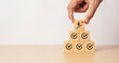 © Achmad Khoeron - Business growth and success concept with hand placing wooden blocks showing check marks, upward progress symbol. Represents strategy, goal achievement, planning, improvement, and long-term development