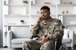 © Prostock-studio - Pensive Black Man In Wheelchair Wearing Military Uniform, Deep In Thought While Sitting In A Modern Office. Reflecting On Experiences And Challenges In A Professional Environment. Healthcare Concept.