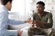 © Prostock-studio - Worried Young Black Man Engaging In Discussion With Therapist In Professional Office Setting, Seeking Guidance And Support For Mental Health, Caring And Understanding Atmosphere. Healthcare Concept.