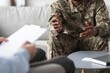 © Prostock-studio - Focused Black Male Soldier Engaging In Conversation With Therapist In Professional Office Setting, Discussing Mental Health Concerns And Stress Management. Mental Health Concept.