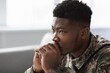 © Prostock-studio - Worried African American Male Soldier, Focused Deep In Thought While Contemplating Issues At Workplace In Military Office, Reflecting On Personal Experiences And Mental Health Concerns.
