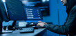 © Art_Photo - Hacker male wearing hoodie typing on computer keyboard in dark room, Concept of cybersecurity, cybercrime, software engineering, dark web, data breaches and modern digital network protection
