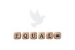 © Fahad - Equality concept with wooden blocks spelling EQUAL, white dove of peace on white background, social justice and human rights symbol