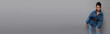 © LIGHTFIELD STUDIOS - A fashionable young woman poses confidently against a sleek gray backdrop.